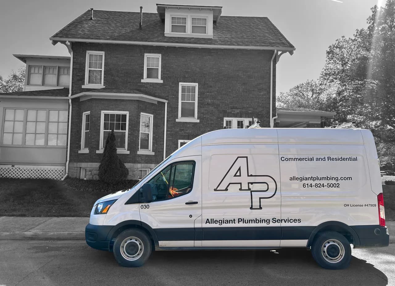 Professional plumber working on water heater installation
