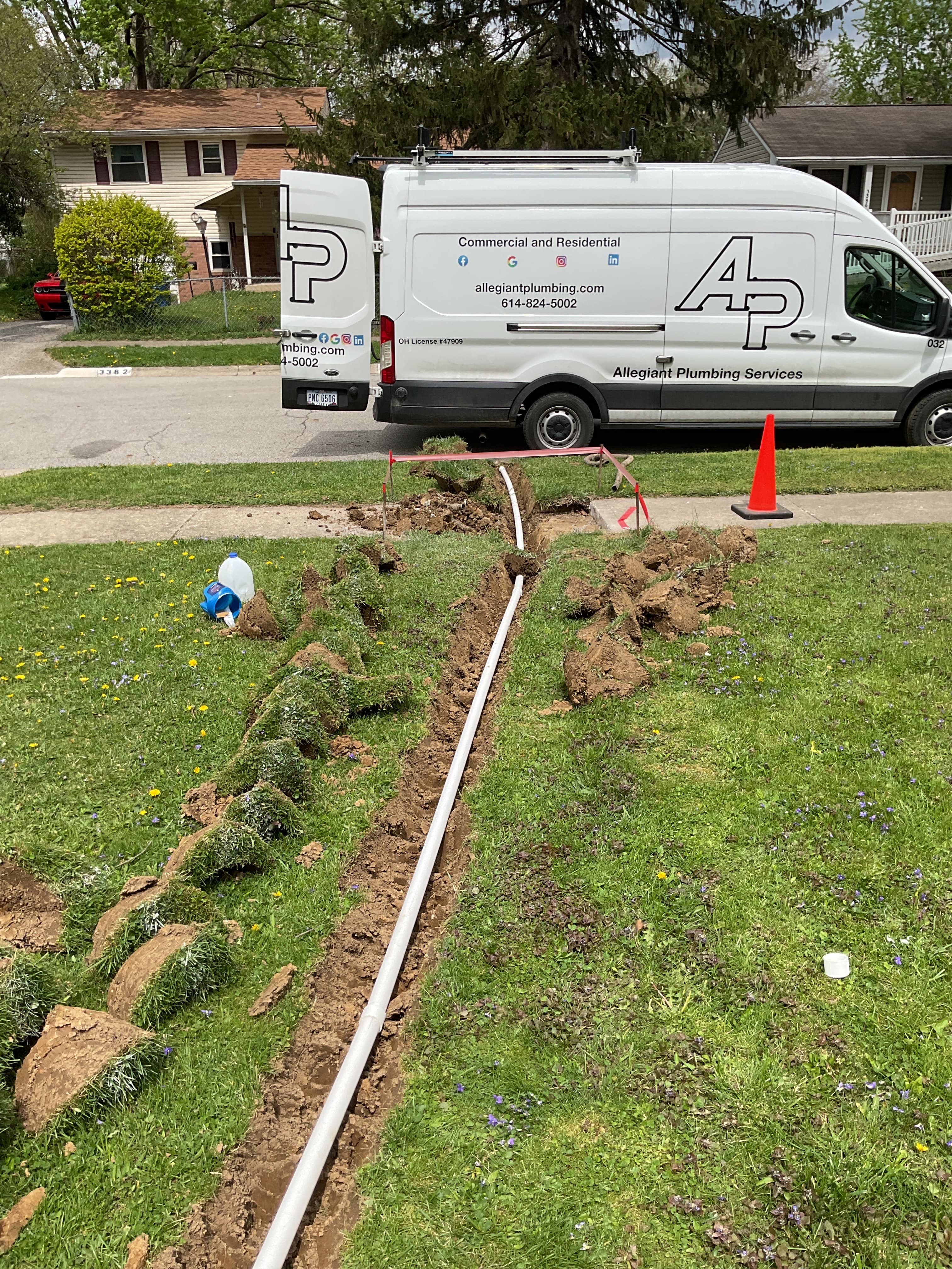 PVC discharge line being installed across a yard leading to the street in Columbus Ohio