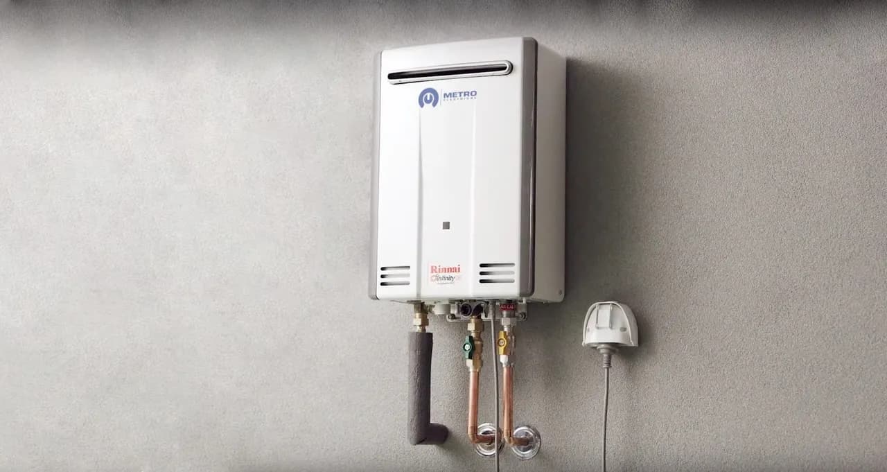 Instant hot water dispenser installed next to kitchen sink