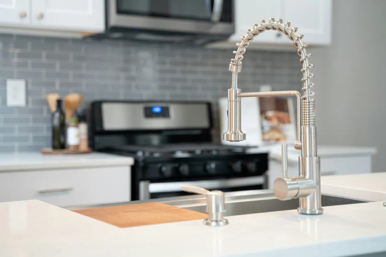 Bright and modern residential kitchen showcasing clean plumbing